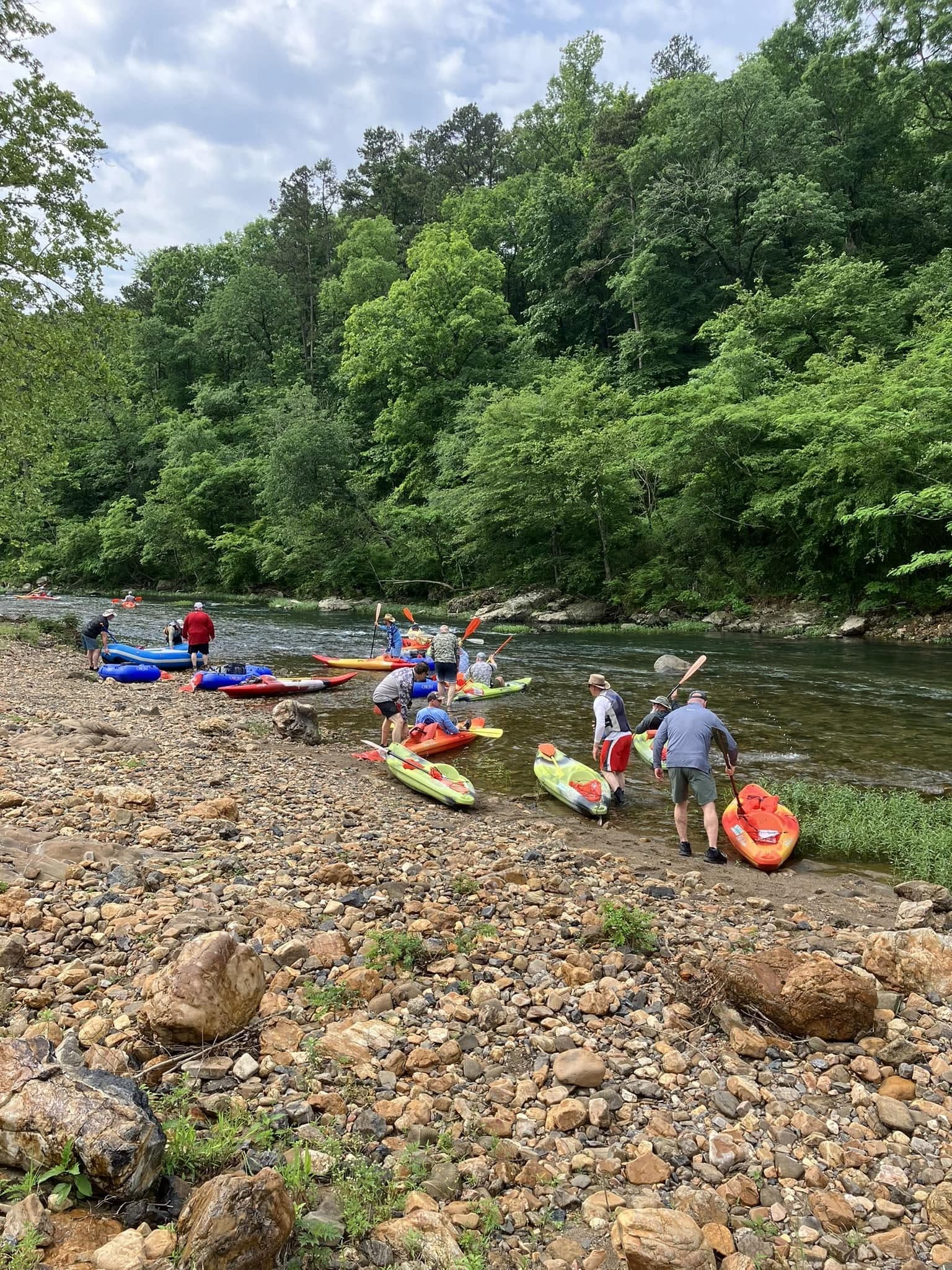 Guests launching kayaks on the Caddo River