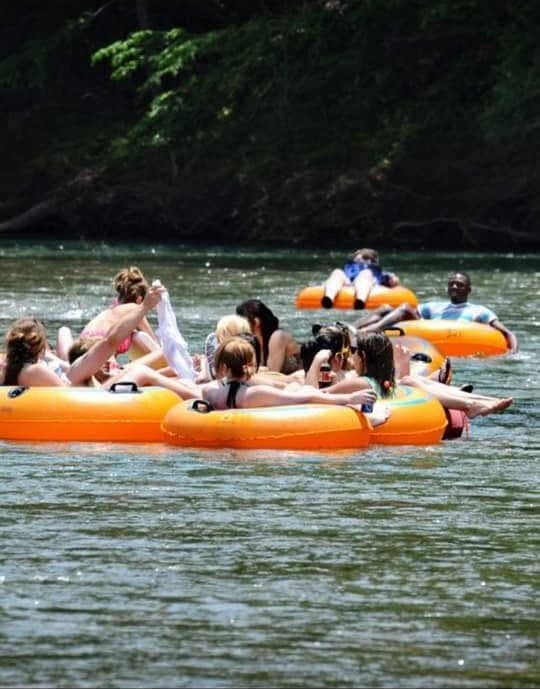 Guests tubing on the river